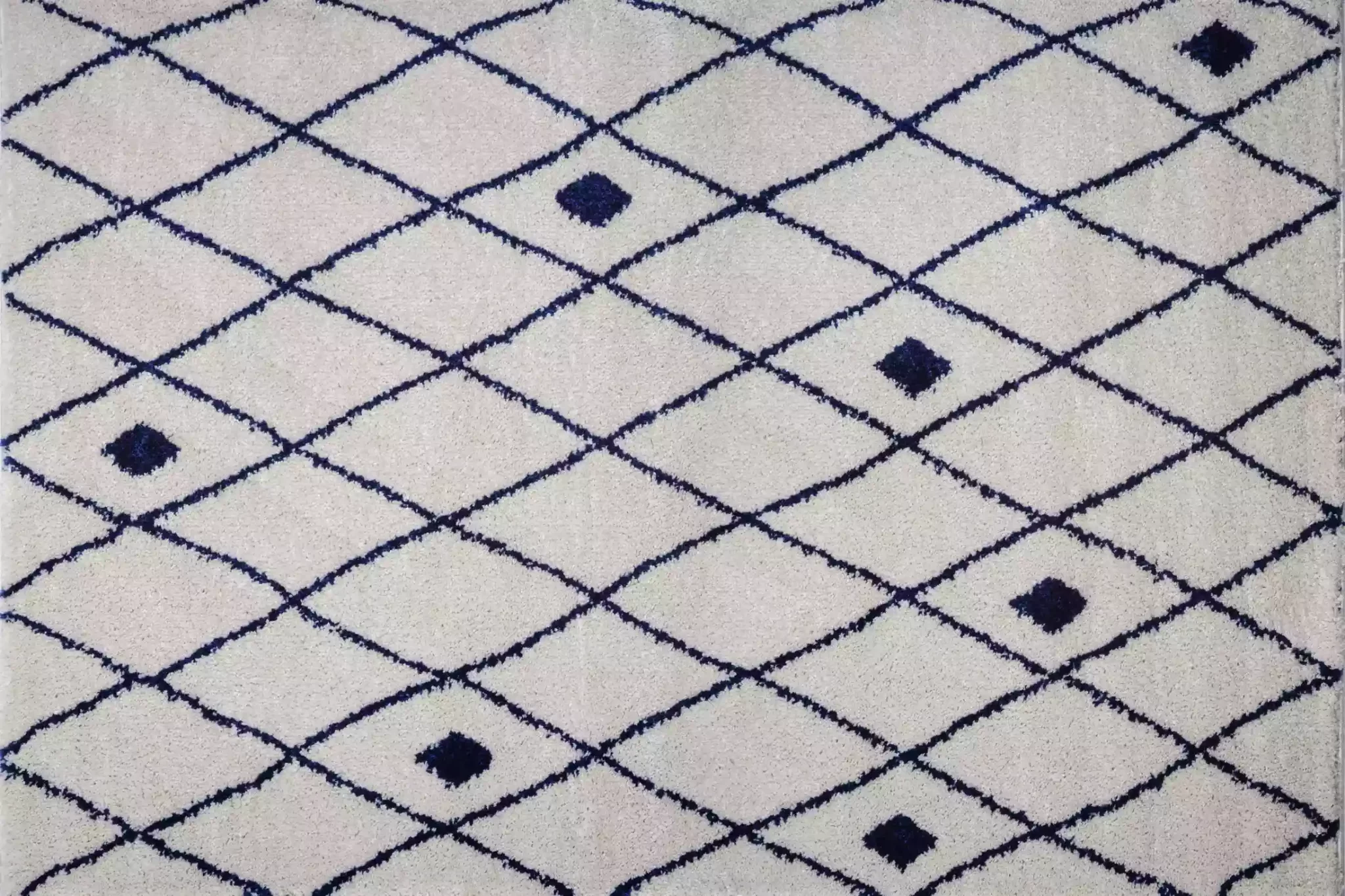 Black and white Morocco rug with geometric diamond motifs.