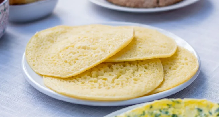 Traditional Moroccan baghrir pancakes served on a plate, a popular street food and breakfast dish.