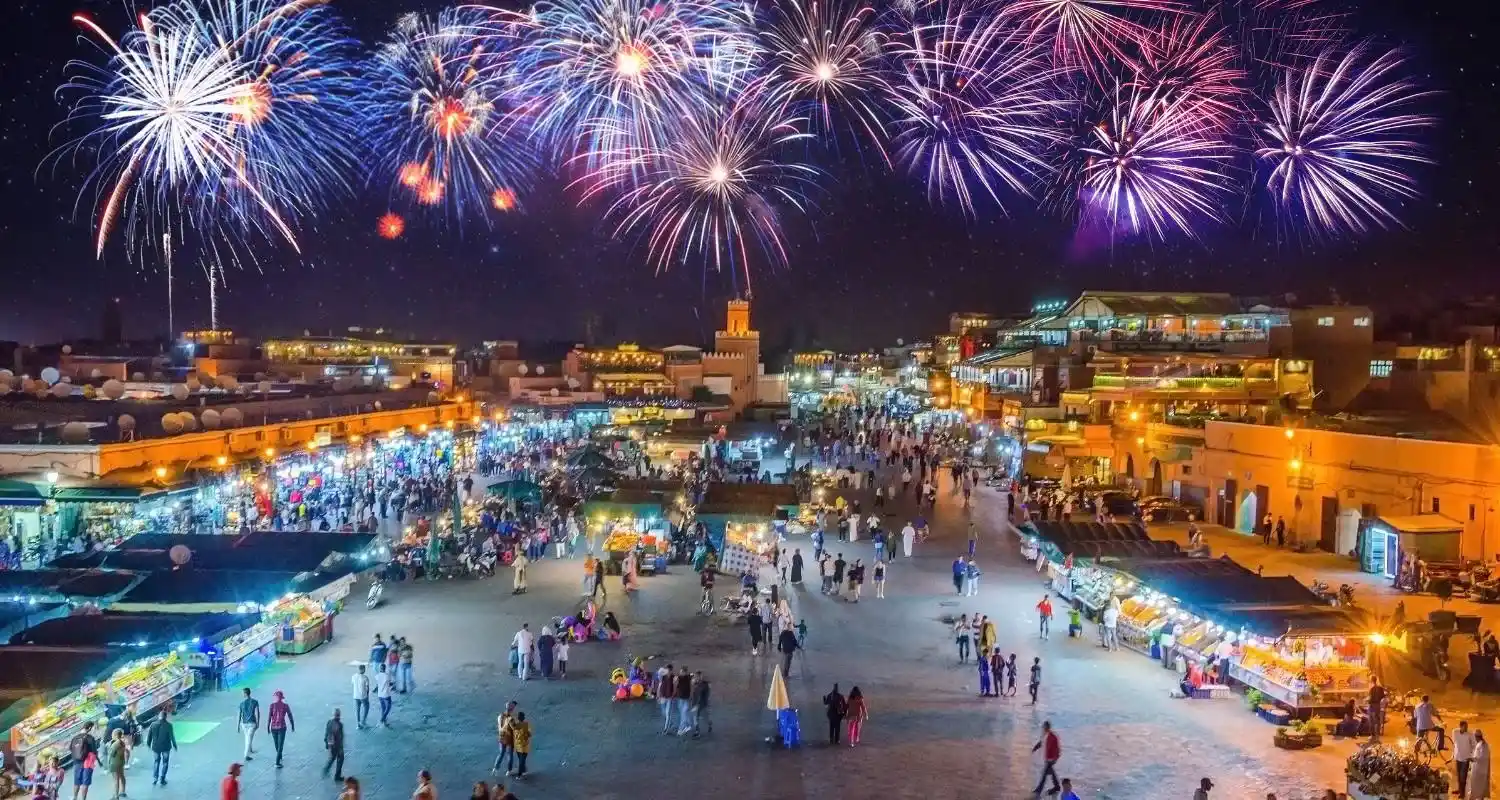 Fireworks over the crowded Jemaa el-Fnaa square in Marrakesh at night